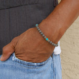 Turquoise cube beaded bracelet with gold spacers and silver lobster clasp.